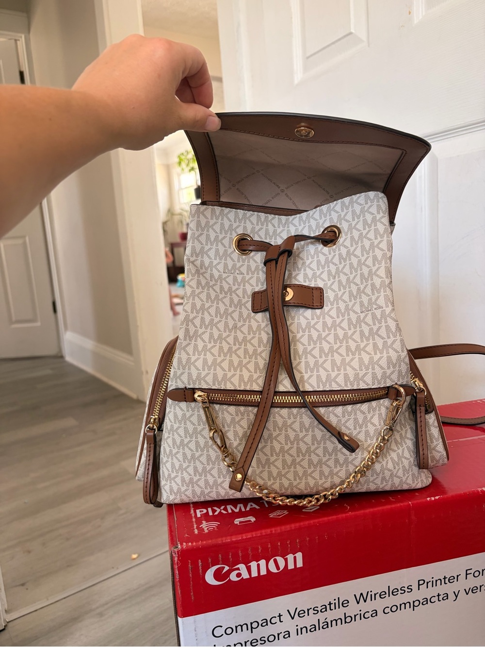 Michael Kors Cream MK Monogram Drawstring Backpack with Brown Trim